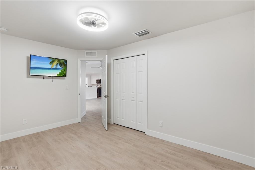 1808 Southwest 30th Street Cape Coral, FL 33914 - Photo 21 of 44 an empty room with shelves and closet