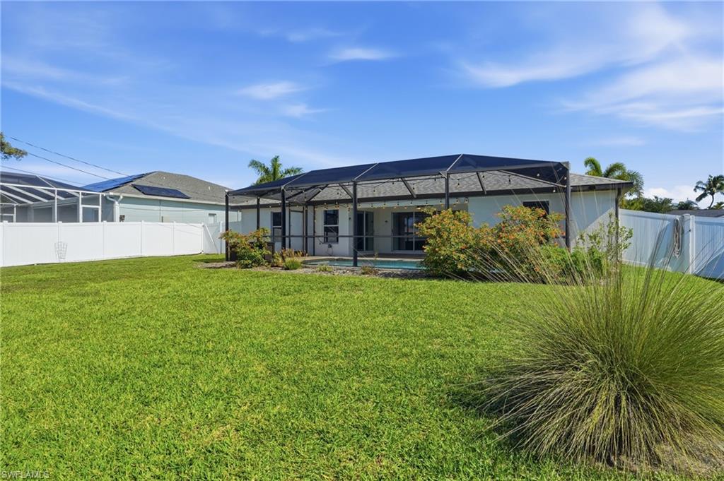 1808 Southwest 30th Street Cape Coral, FL 33914 - Photo 40 of 44 a front view of a house with garden