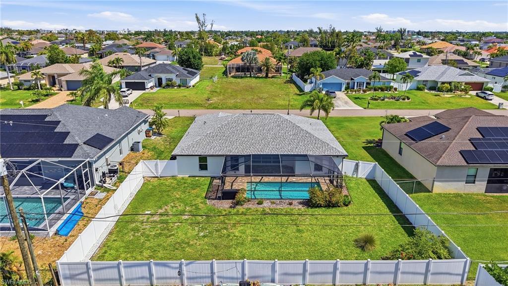 1808 Southwest 30th Street Cape Coral, FL 33914 - Photo 43 of 44 an aerial view of residential houses with outdoor space and swimming pool