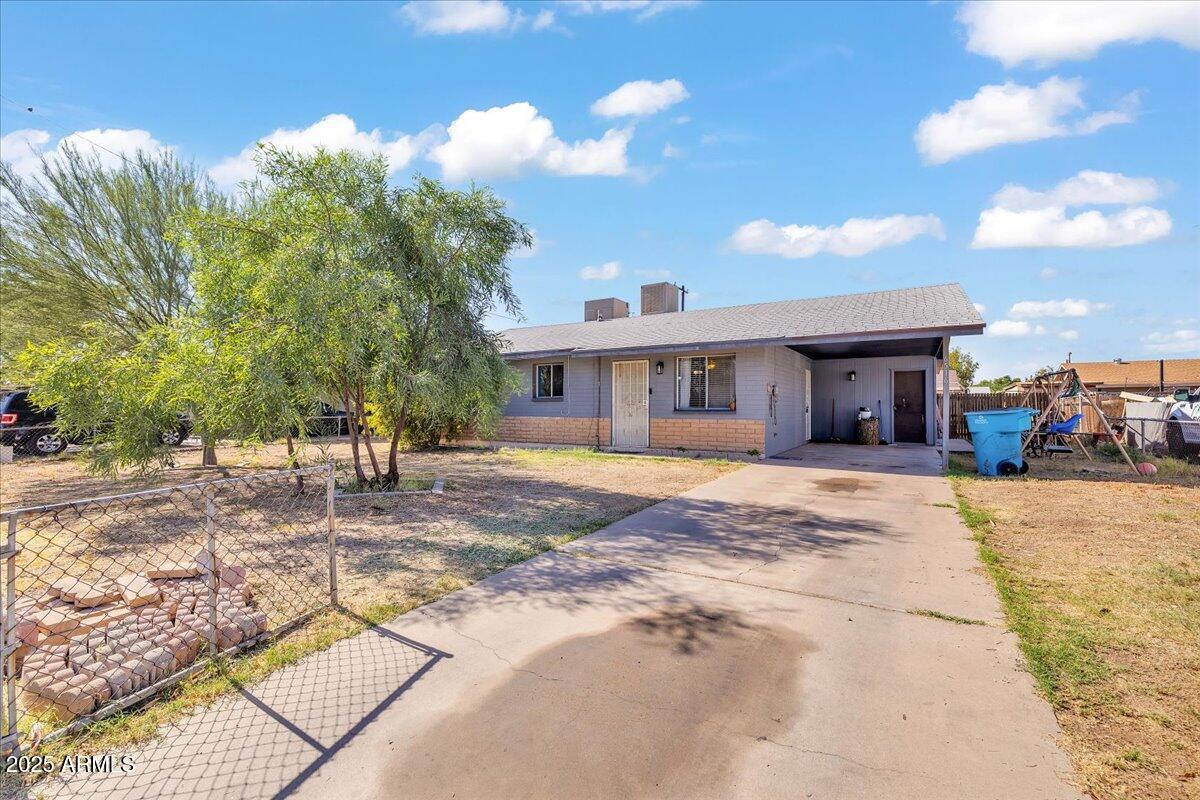 6516 West Cheery Lynn Road Phoenix, AZ 85033 - Photo 2 of 26 a view of a house with a patio