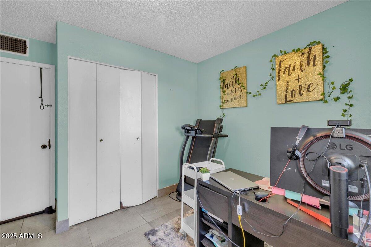 6516 West Cheery Lynn Road Phoenix, AZ 85033 - Photo 8 of 26 a view of a room with gym equipment