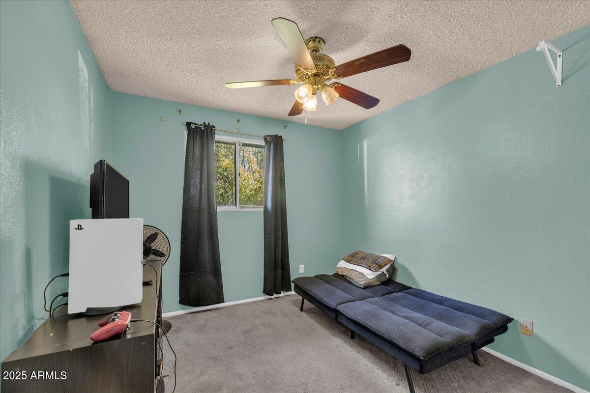 6516 West Cheery Lynn Road Phoenix, AZ 85033 - Photo 9 of 26 a living room with furniture and a window