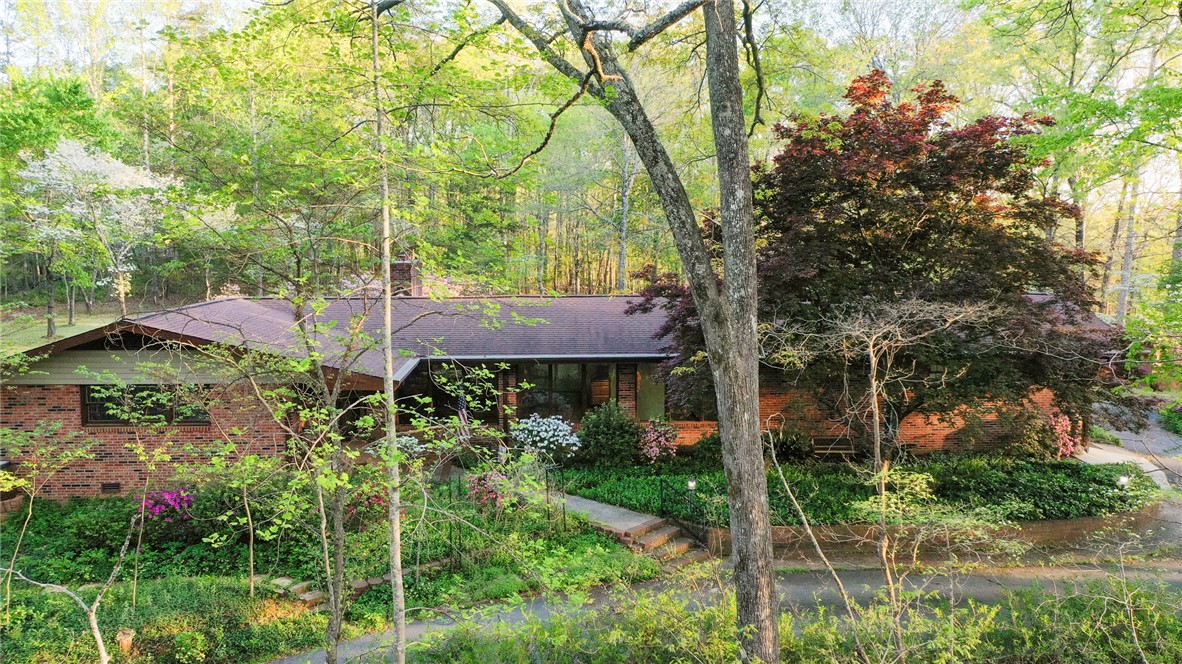 139 Todds Creek Road Central, SC 29630 - Photo 41 of 45 This charming home is nestled among lush greenery, offering a serene and private living experience.