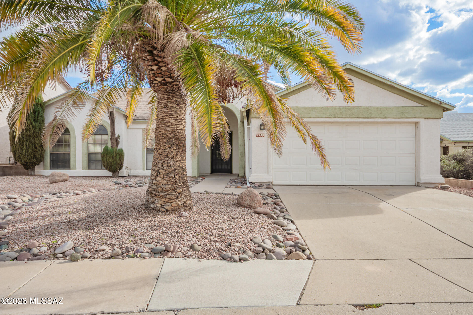 5331 West Eaglestone Loop Tucson, AZ 85742 - Photo 2 of 35 a view of a white house with a tree