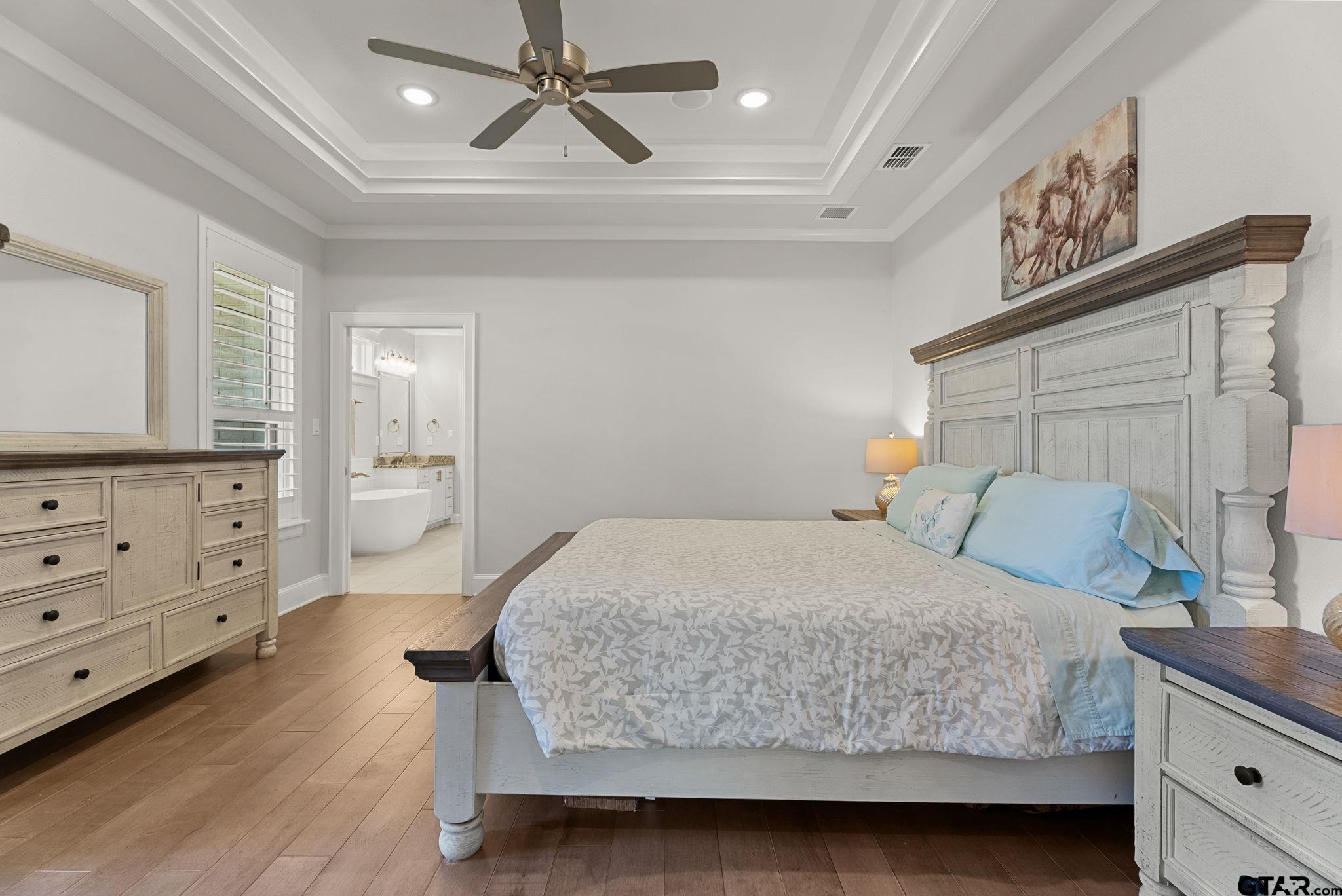 9035 Shallow Cove Tyler, TX 75703 - Photo 12 of 31 a bedroom with a bed and dresser