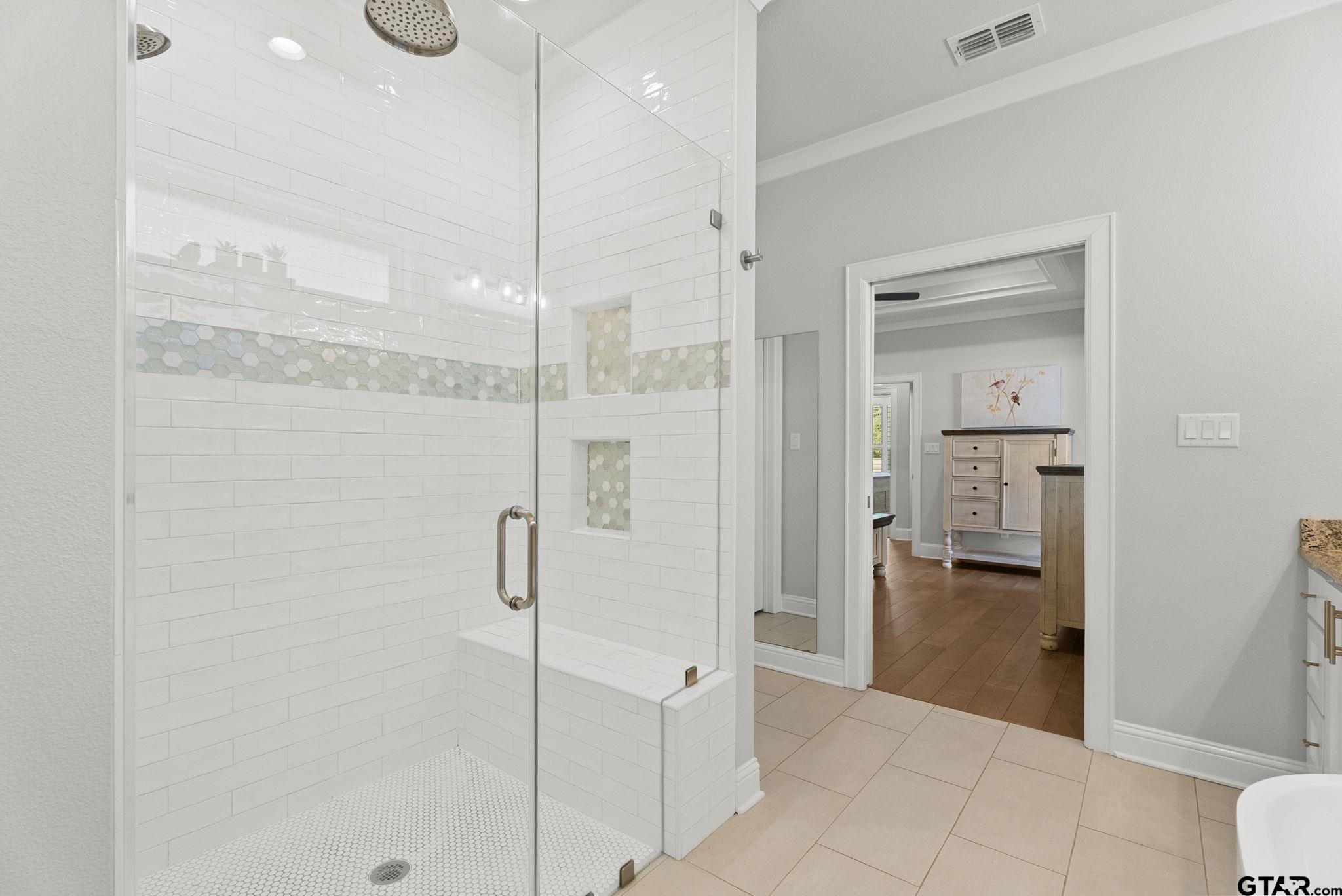 9035 Shallow Cove Tyler, TX 75703 - Photo 14 of 31 a bathroom with a shower and a sink