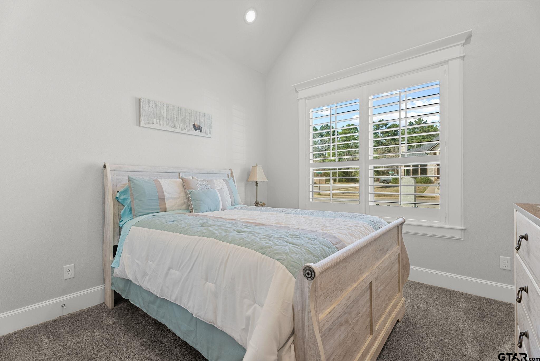 9035 Shallow Cove Tyler, TX 75703 - Photo 15 of 31 a bedroom with a bed and a window