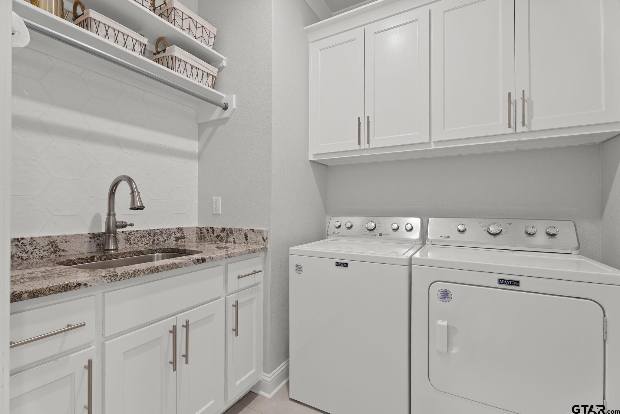 9035 Shallow Cove Tyler, TX 75703 - Photo 23 of 31 a utility room with dryer and washer