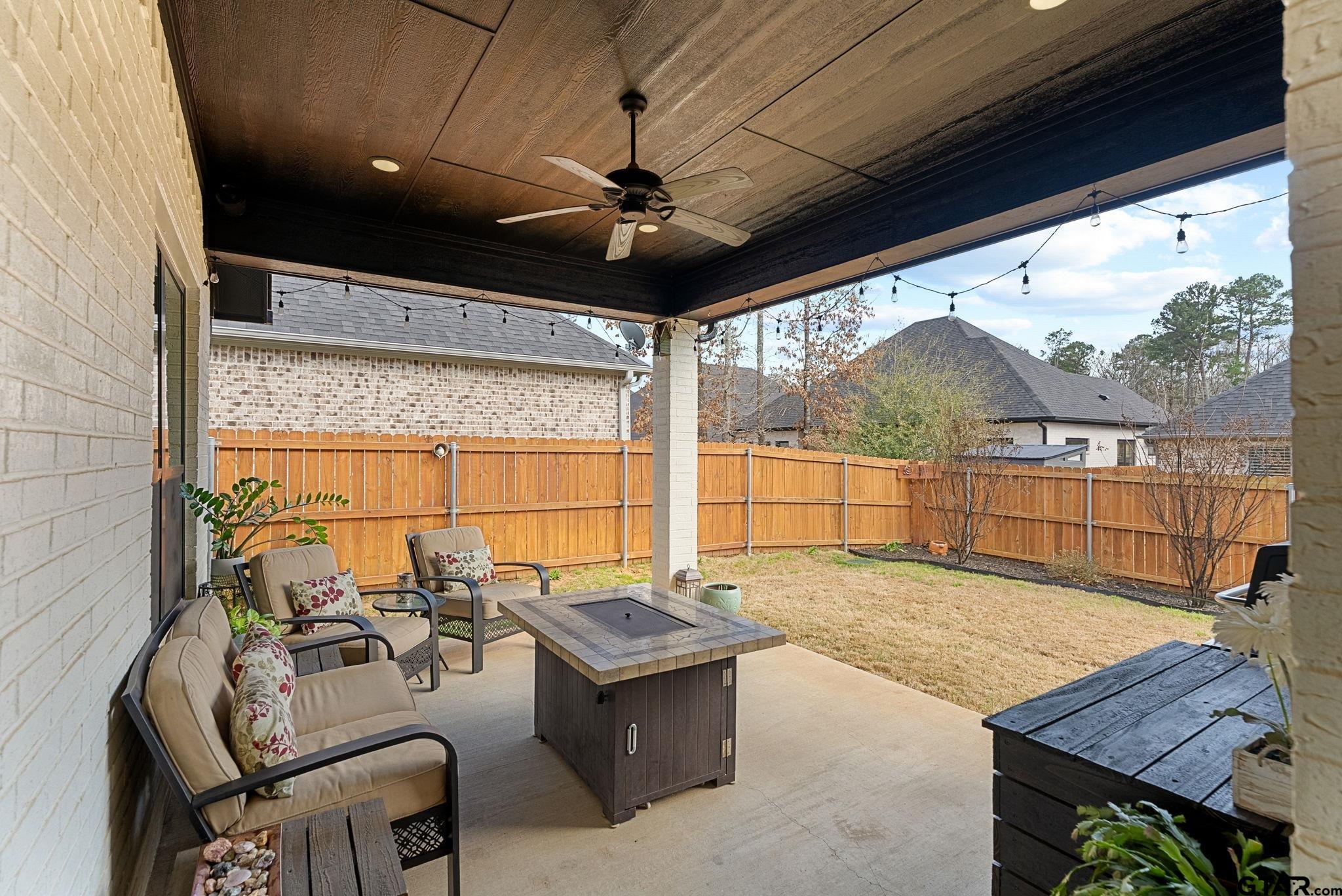 9035 Shallow Cove Tyler, TX 75703 - Photo 24 of 31 a view of a porch with furniture and a yard