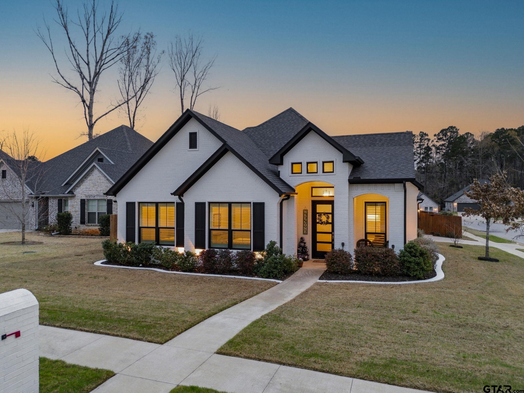 9035 Shallow Cove Tyler, TX 75703 - Photo 29 of 31 a front view of a house with garden