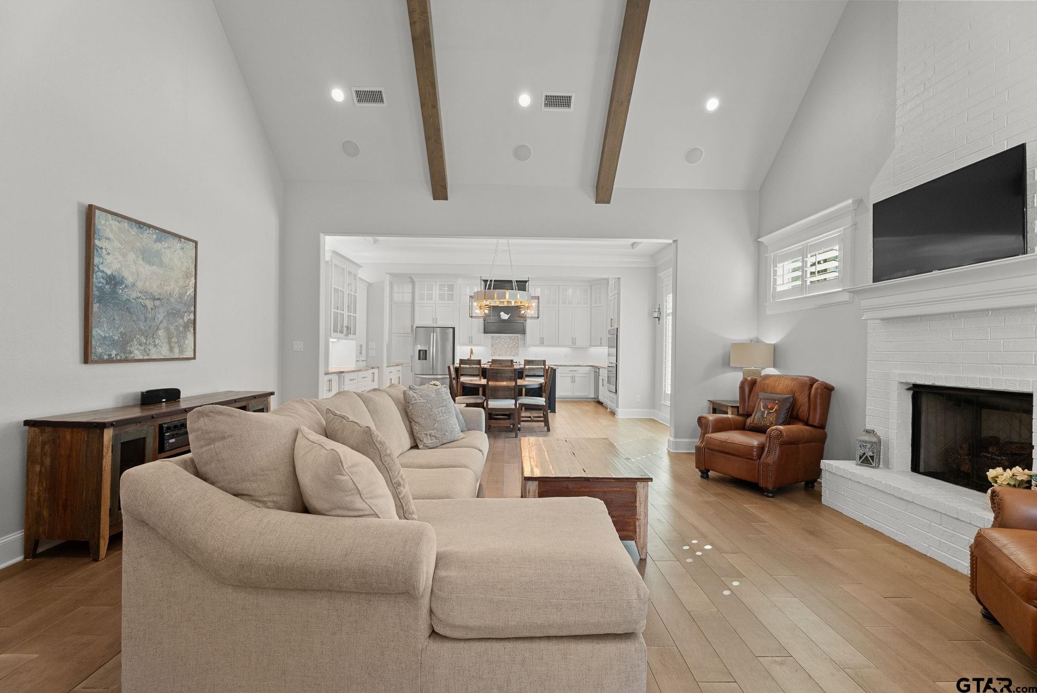 9035 Shallow Cove Tyler, TX 75703 - Photo 5 of 31 a living room with furniture fireplace and flat screen tv