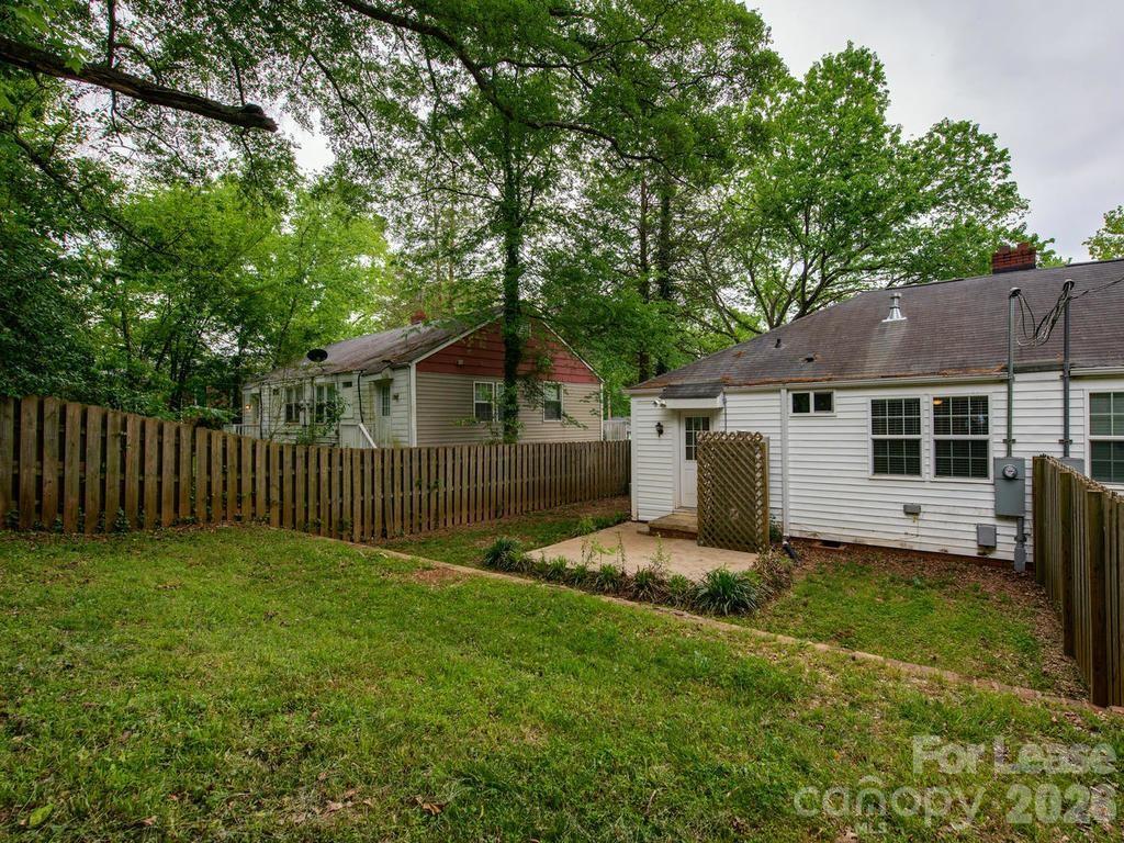 5113 Valley Stream Road Charlotte, NC 28209 - Photo 17 of 17 a view of a house with a yard and a large tree