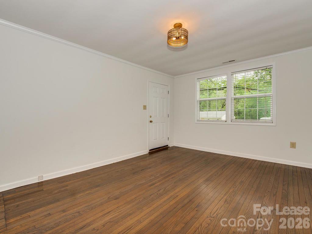 5113 Valley Stream Road Charlotte, NC 28209 - Photo 4 of 17 an empty room with a window