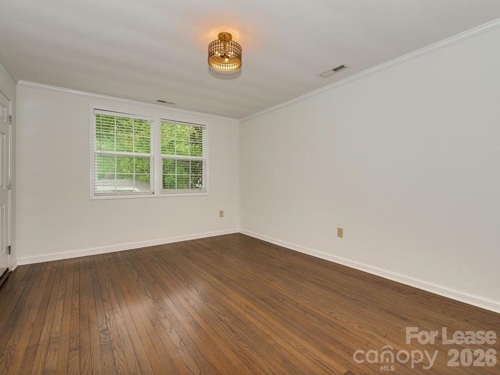5113 Valley Stream Road Charlotte, NC 28209 - Photo 5 of 17 an empty room with a window