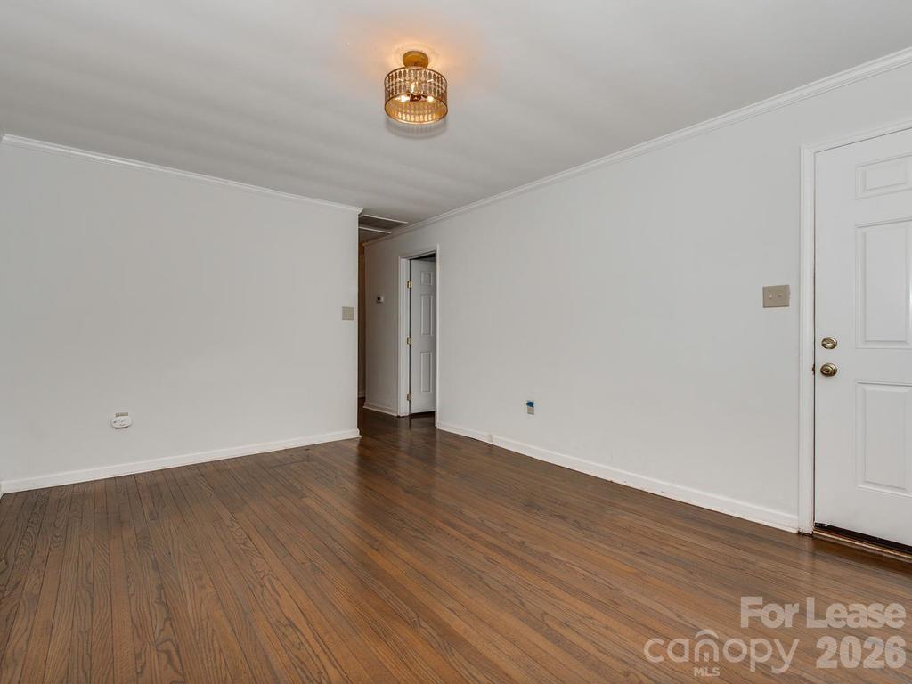 5113 Valley Stream Road Charlotte, NC 28209 - Photo 6 of 17 a view of an empty room with a window