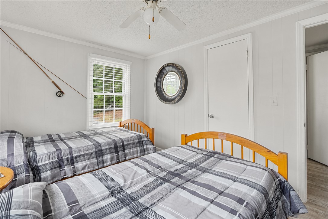 111 State Rd S-4-104 Anderson, SC 29626 - Photo 13 of 42 Bright and inviting bedroom with natural light, showcasing comfortable living space and practical design.