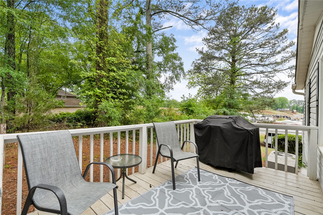 111 State Rd S-4-104 Anderson, SC 29626 - Photo 16 of 42 This spacious deck offers a tranquil retreat with lush tree views, ideal for outdoor gatherings.