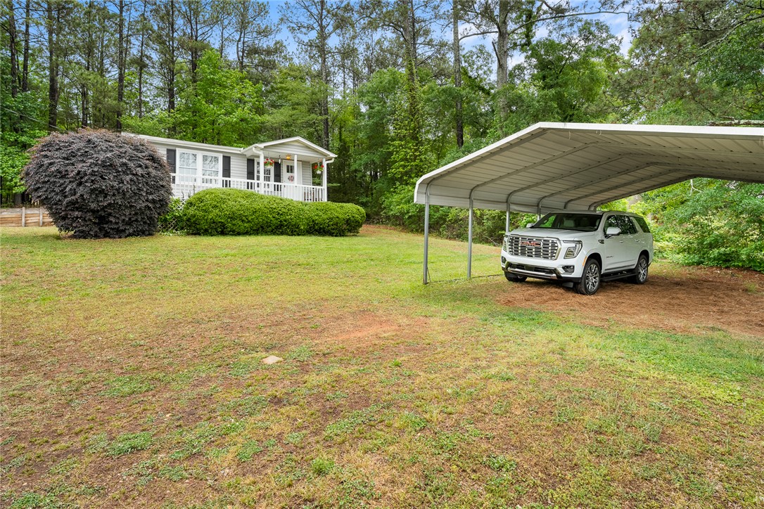 111 State Rd S-4-104 Anderson, SC 29626 - Photo 19 of 42 This charming home features a lovely front porch and a convenient carport.