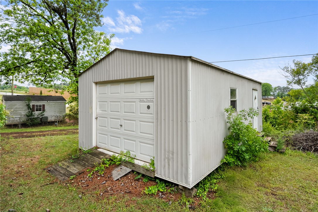 111 State Rd S-4-104 Anderson, SC 29626 - Photo 21 of 42 This outdoor shed offers ample storage and utility space for various needs.