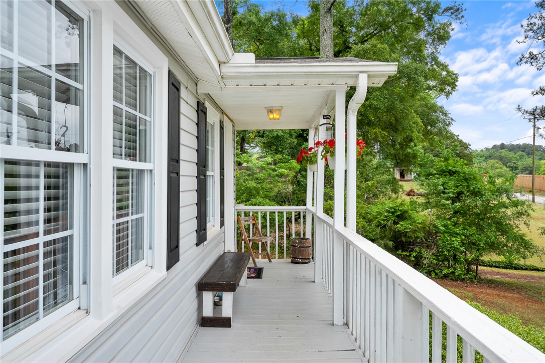 111 State Rd S-4-104 Anderson, SC 29626 - Photo 3 of 42 This inviting porch offers serene views, perfect for peaceful mornings or relaxing evenings.