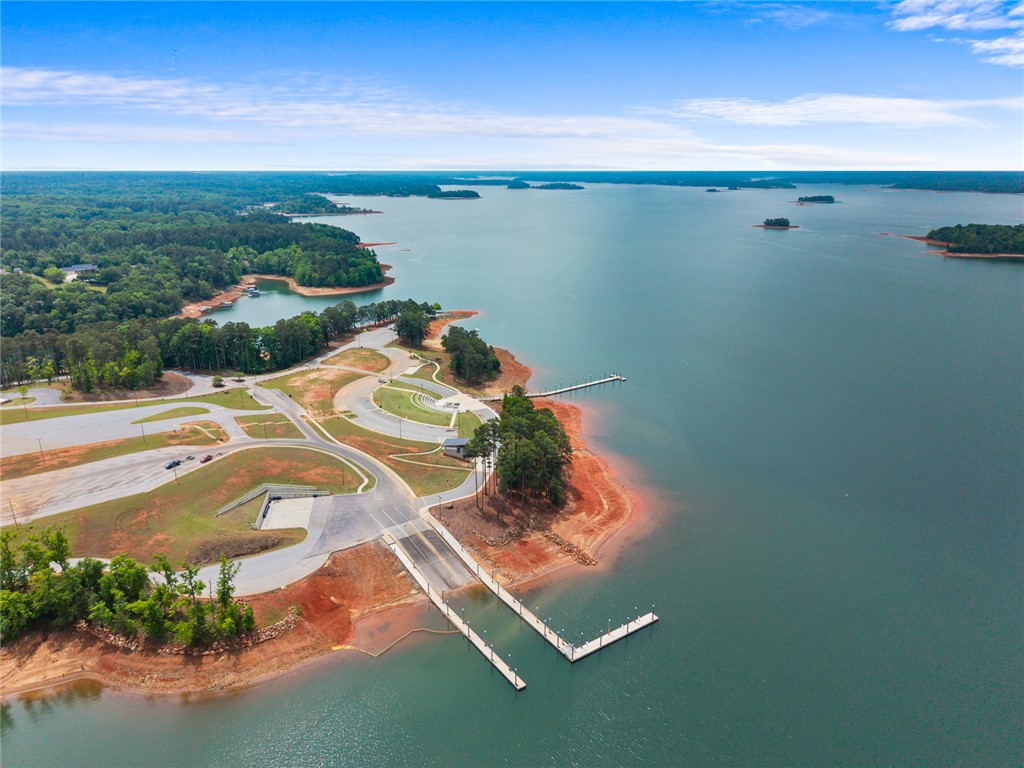 111 State Rd S-4-104 Anderson, SC 29626 - Photo 34 of 42 This aerial view showcases a vibrant waterfront boating and camping park with ample access to the lake.