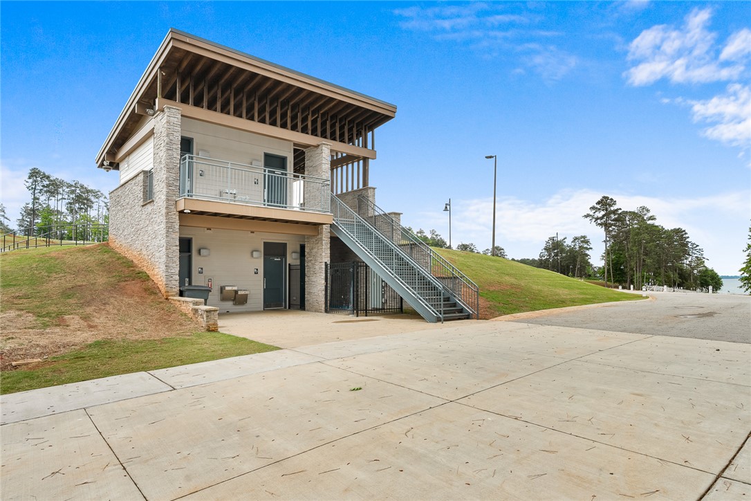 111 State Rd S-4-104 Anderson, SC 29626 - Photo 37 of 42 This structure within Green Pond Landing features modern architecture with quick access to bathroom amenity complemented by an exterior staircase and balcony.