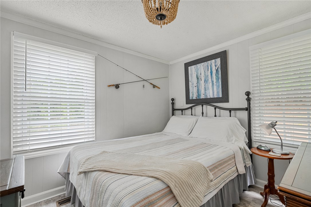 111 State Rd S-4-104 Anderson, SC 29626 - Photo 10 of 42 This cozy bedroom features bright windows, offering a peaceful and inviting retreat.