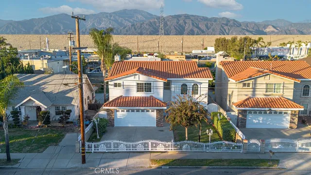 a front view of residential houses with yard