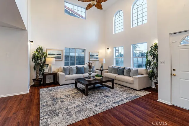 a living room with furniture or couch and a wooden floor