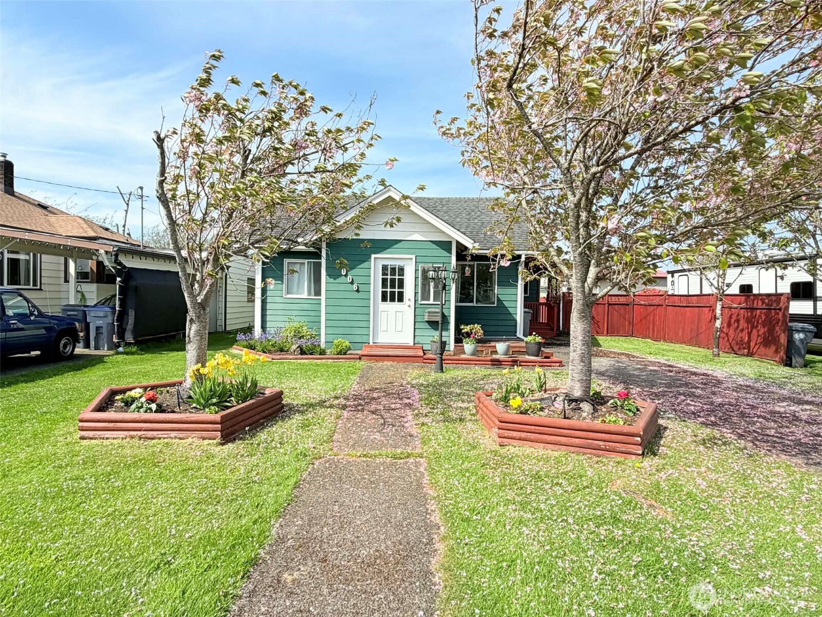 2006 West Second Street Aberdeen, WA 98520 - Photo 2 of 39 a front view of a house with a yard table and chairs