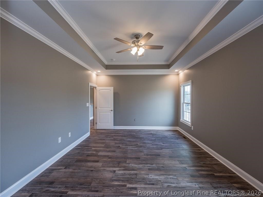 1102 West Carthage Road Lumberton, NC 28360 - Photo 19 of 41 a view of an empty room with window and chandelier fan