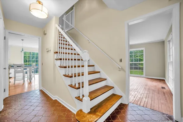 a view of entryway with stairs and wooden floor