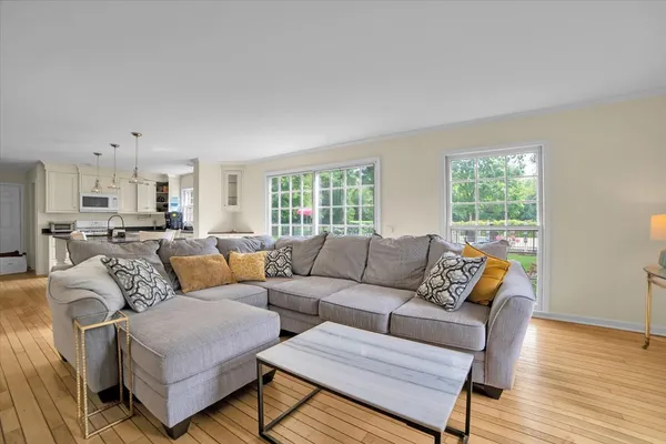 a living room with furniture and a window