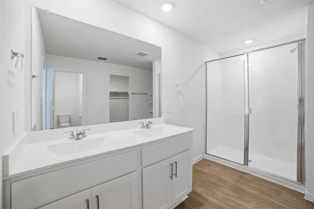 a bathroom view of a toilet and a shower