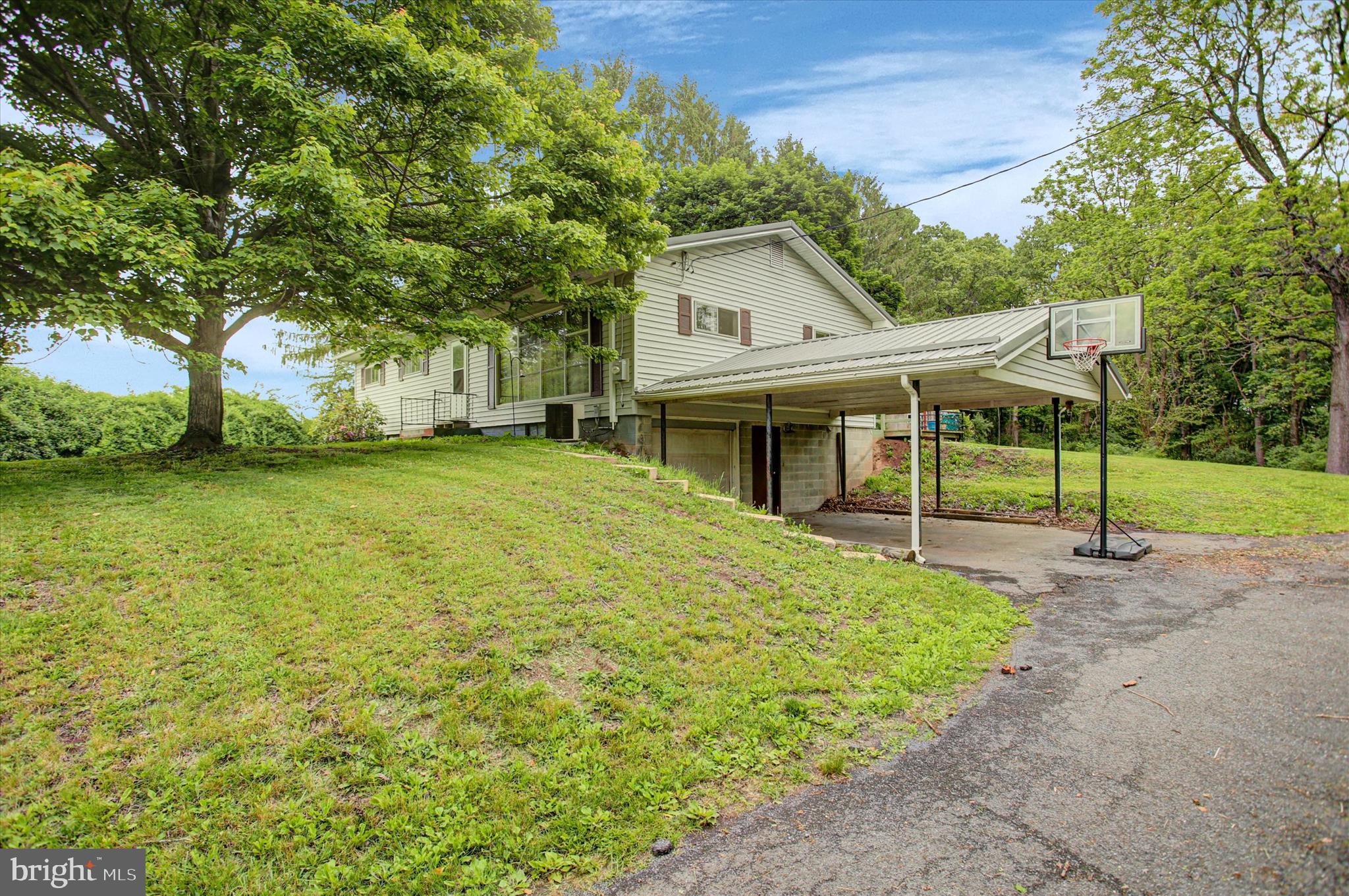 5156 Peach Orchard Road McConnellsburg, PA 17233 - Photo 5 of 34 a view of a house with backyard and tree
