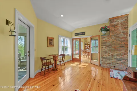 a view of a livingroom with furniture and wooden floor