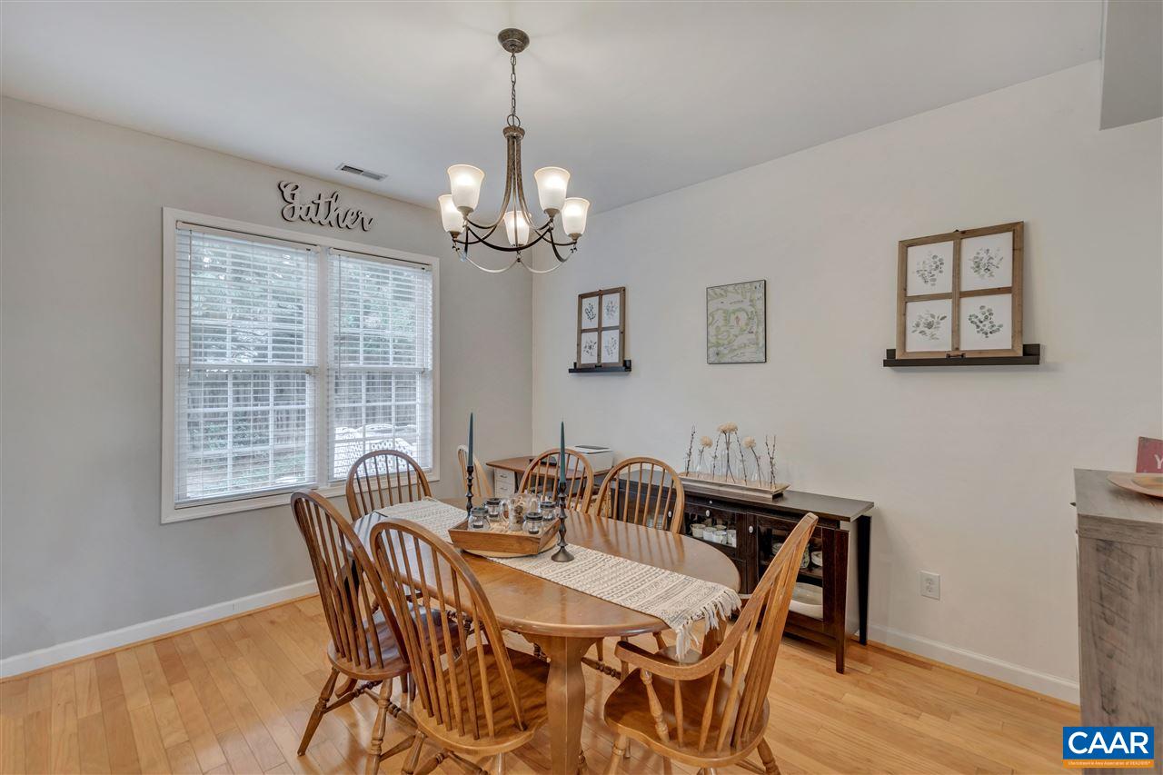 1345 Amber Ridge Road Charlottesville, VA 22901 - Photo 13 of 34 a view of a dining room with furniture window and wooden floor
