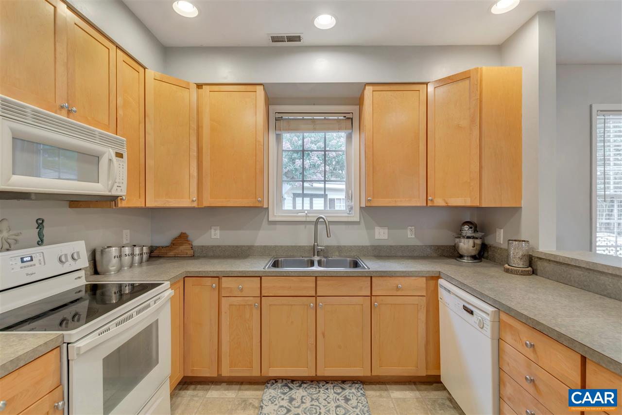 1345 Amber Ridge Road Charlottesville, VA 22901 - Photo 16 of 34 a kitchen with stainless steel appliances granite countertop white cabinets sink and window