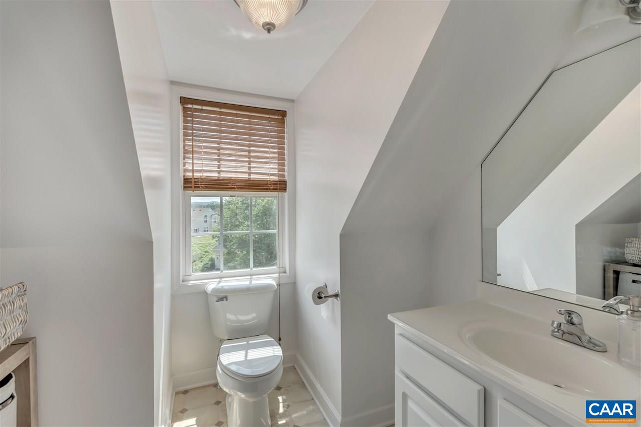 1345 Amber Ridge Road Charlottesville, VA 22901 - Photo 27 of 34 a bathroom with a sink toilet and a mirror