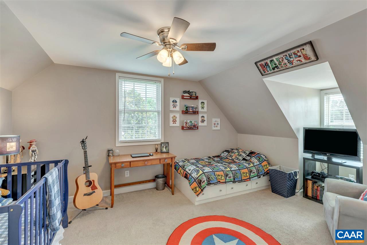 1345 Amber Ridge Road Charlottesville, VA 22901 - Photo 29 of 34 a bedroom with furniture and a flat screen tv