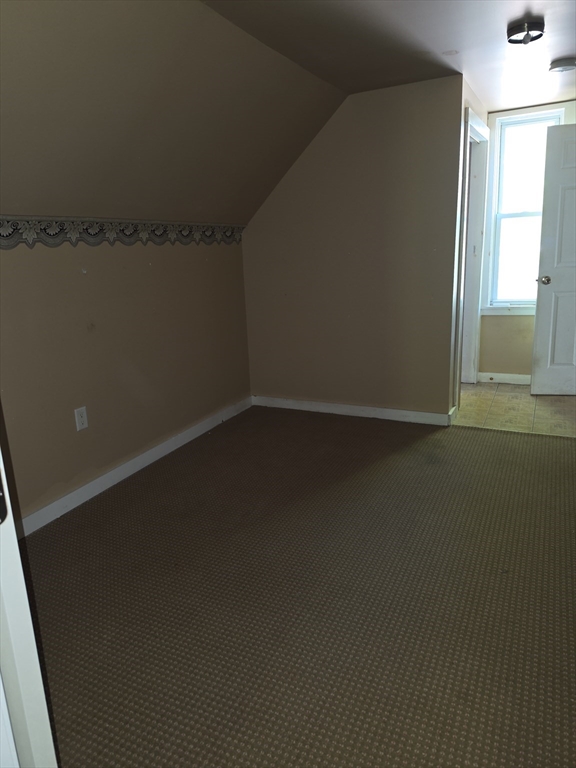 44-th 19th Street, Unit REAR Lowell, MA 01850 - Photo 5 of 13 an empty room with a window