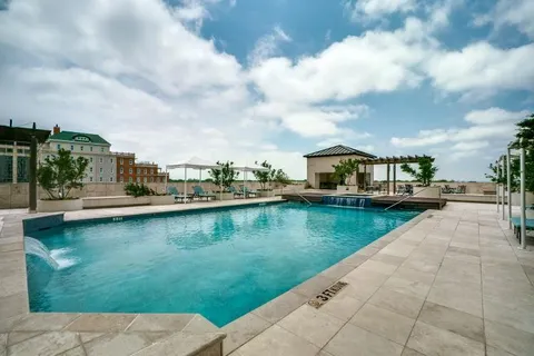 a view of swimming pool from a yard