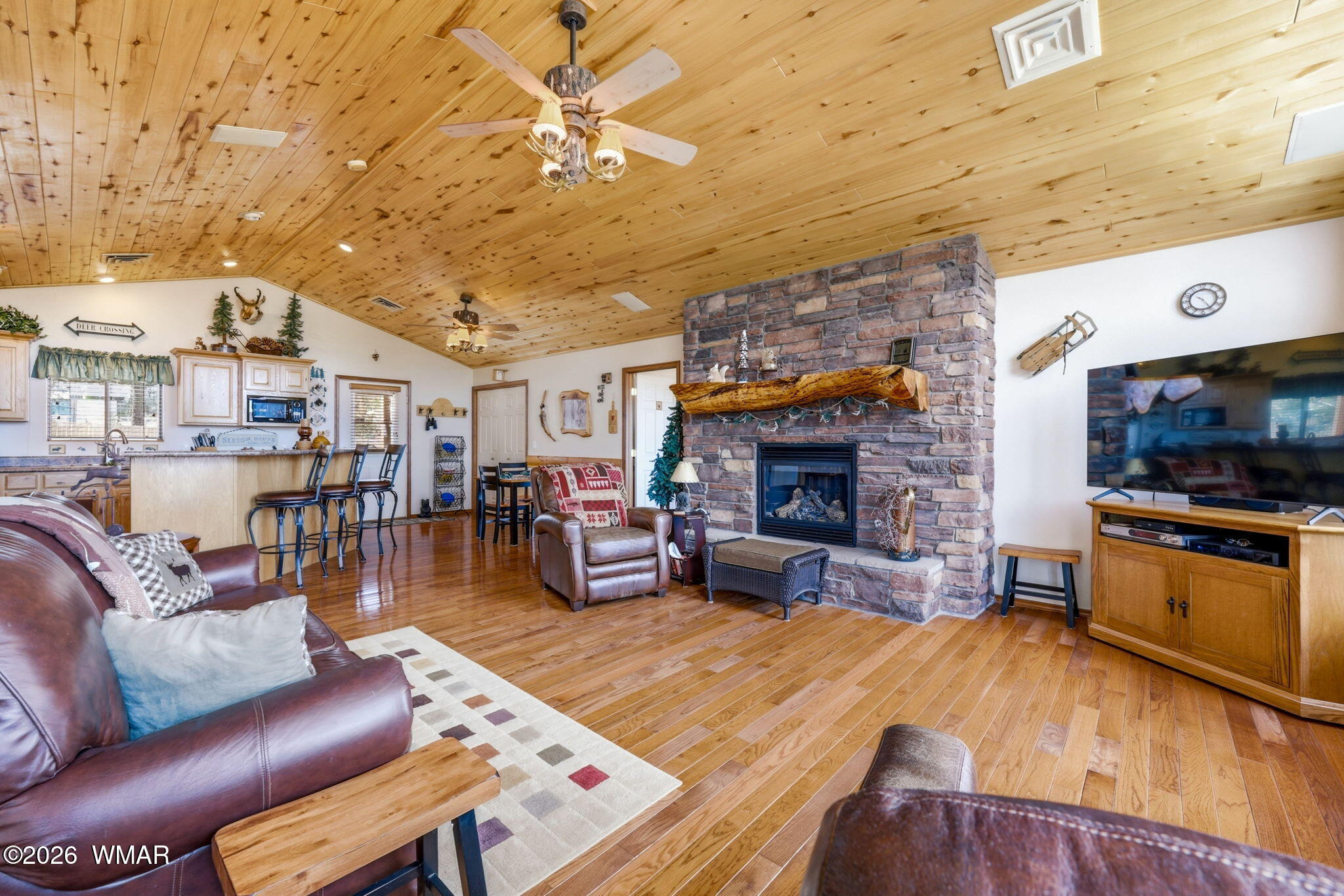 3650 Pine Rim Drive Overgaard, AZ 85933 - Photo 5 of 36 a living room with furniture and a fireplace