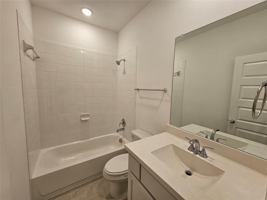 3915 Chesapeake Lane Crandall, TX 75114 - Photo 15 of 32 a bathroom with a sink toilet and shower