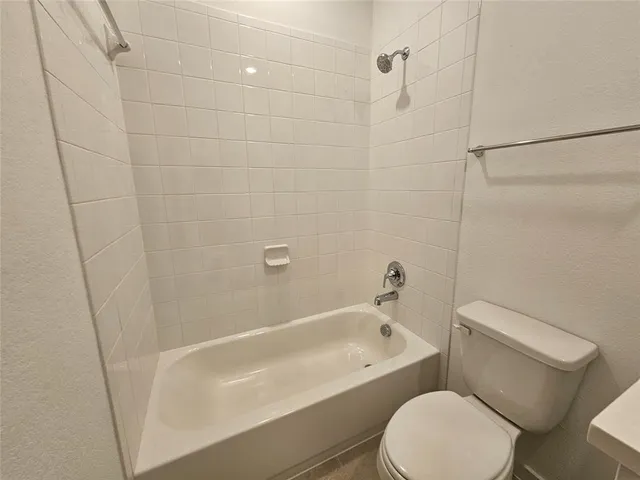 a view of an empty room and closet