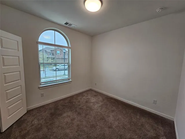 a spacious bathroom with a sink and a mirror