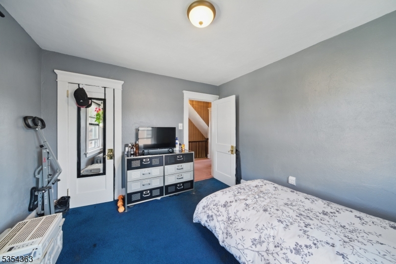 149 Roessler Street Boonton, NJ 07005 - Photo 12 of 30 a bedroom with a bed and a flat screen tv