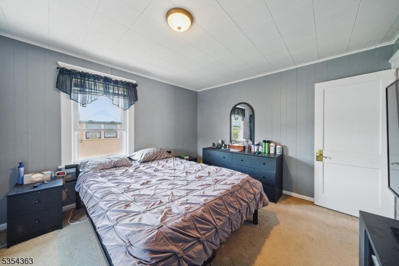 149 Roessler Street Boonton, NJ 07005 - Photo 13 of 30 a bedroom with a bed and a dresser