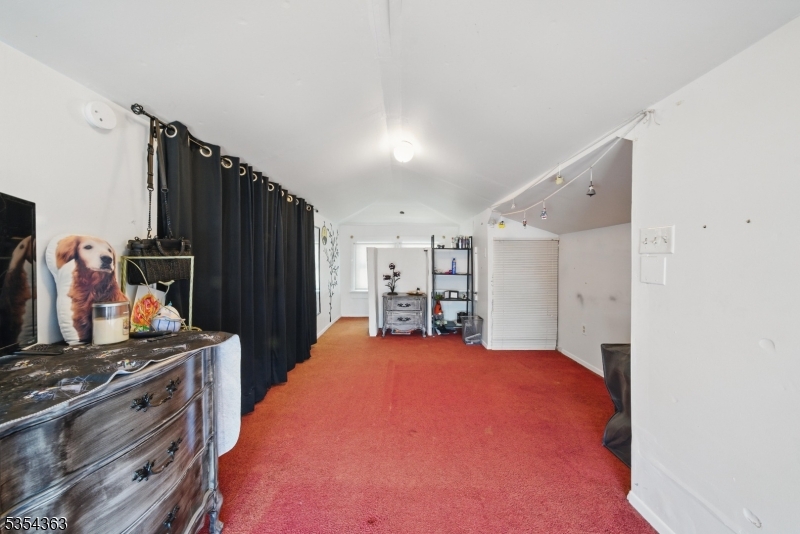 149 Roessler Street Boonton, NJ 07005 - Photo 17 of 30 a room with furniture and a flat screen tv