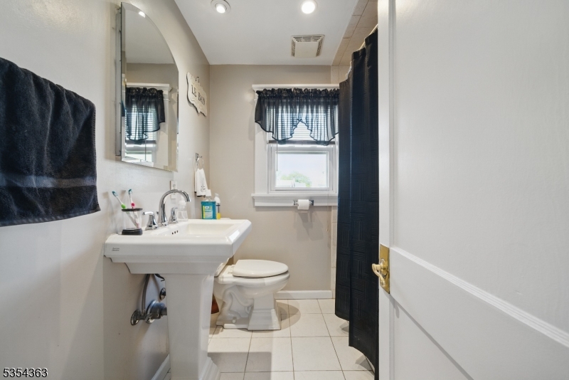 149 Roessler Street Boonton, NJ 07005 - Photo 18 of 30 a bathroom with a sink toilet and shower